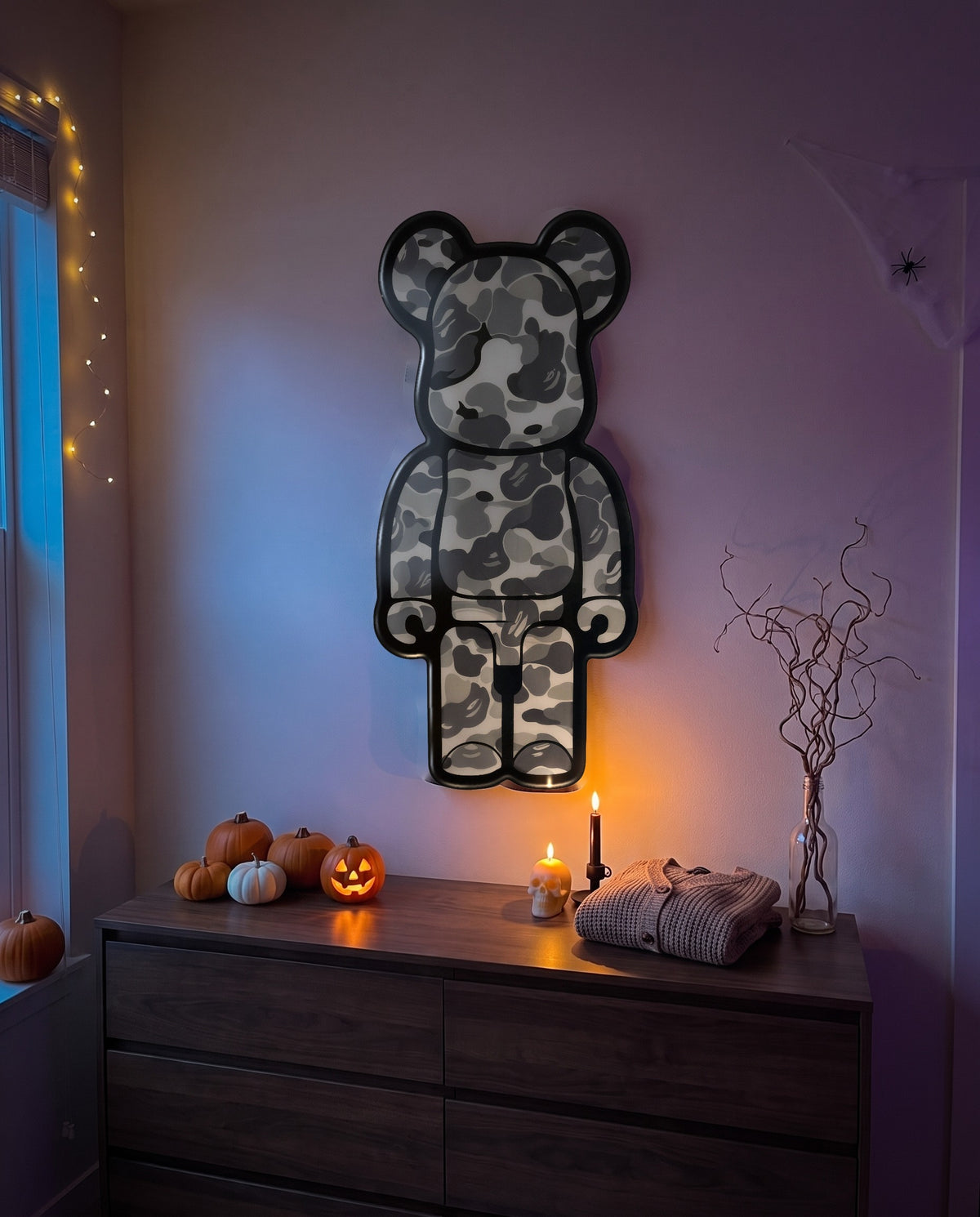 Grey Camo Bear Wallart hanging on the wall above a dresser in a Halloween-decorated room