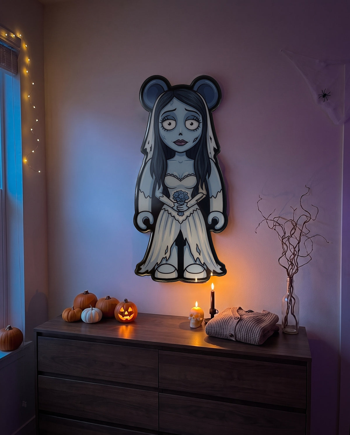 Emily (Corpse Bride) Halloween Bear Wall Art hanging on the wall above a dresser in a Halloween-decorated room