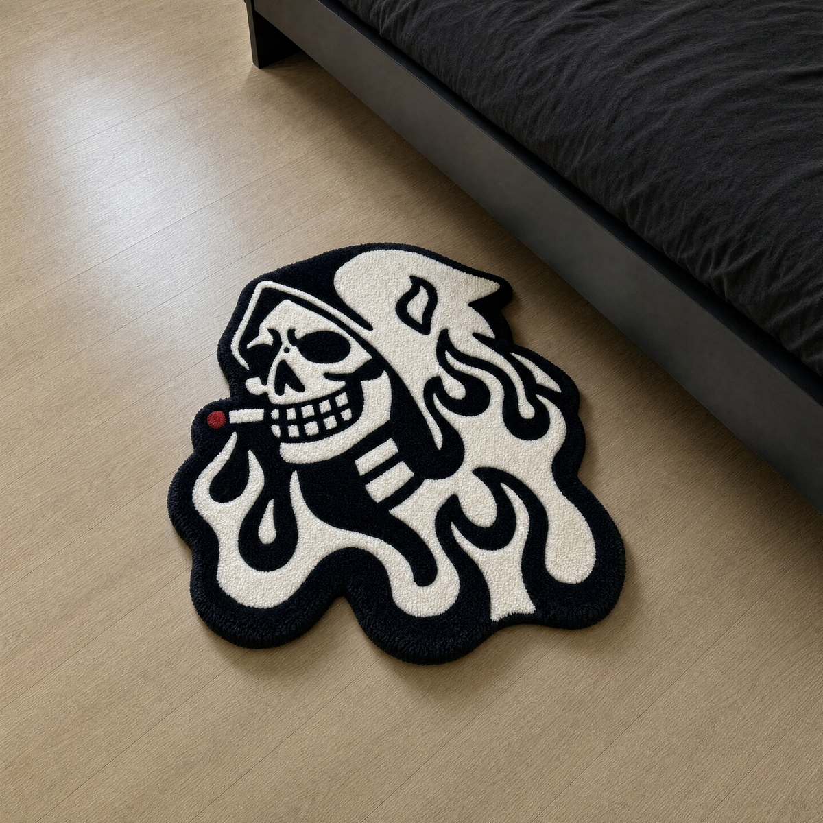 Custom hand-tufted rug on a light wood floor beside a matte black bed in a minimal black bedroom