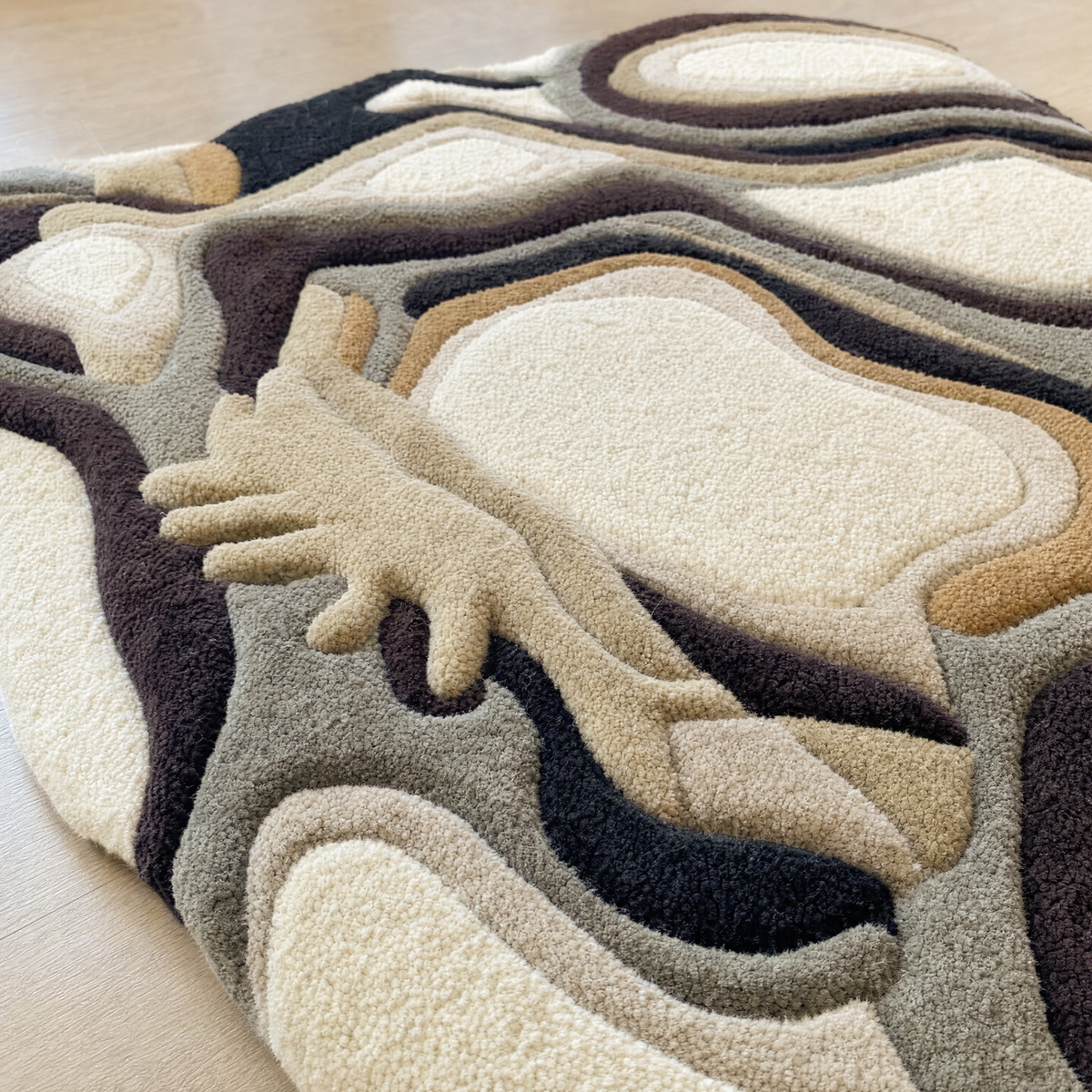 Close-up of the carved pile and grooves on the hand-tufted rug
